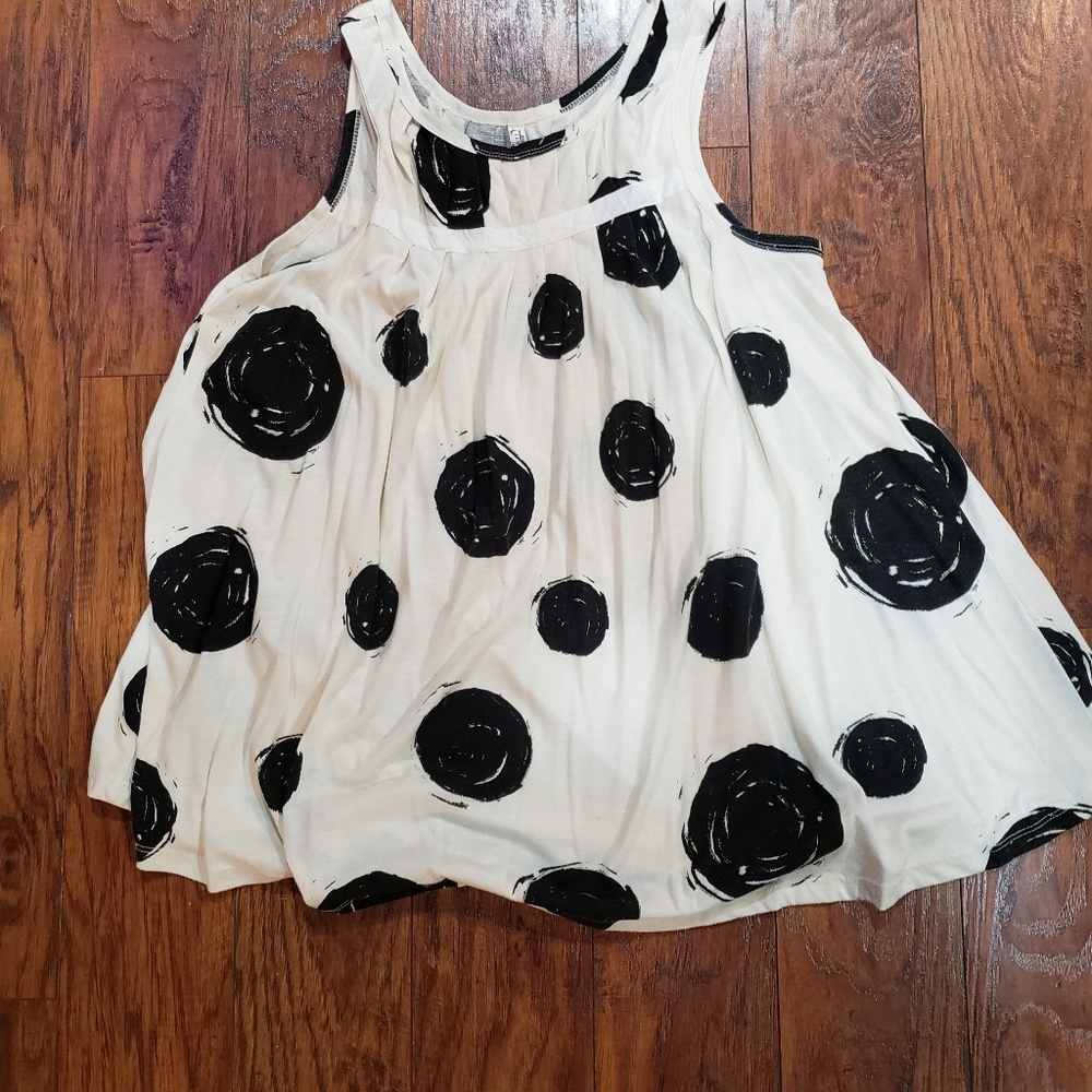 Cream color with big black polka dots